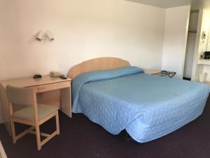 Ένα ή περισσότερα κρεβάτια σε δωμάτιο στο Luxury Inn