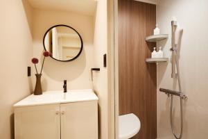 a bathroom with a sink and a mirror at LiveGRACE Mabuji Park Hotel - Vacation STAY 51973v in Tokyo +23 photos