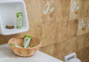 a basket of toiletries sitting on the top of a toilet at Vagia Traditional, Aegina Island in Vaia