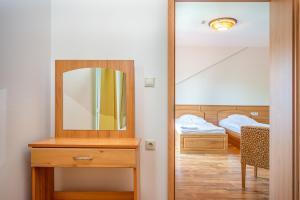 Postel nebo postele na pokoji v ubytování Nefelejcs Hotel