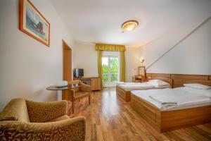 Postel nebo postele na pokoji v ubytování Nefelejcs Hotel