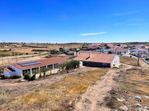 an aerial view of a house in a field at Moinho do Monte Branco in Castro Verde