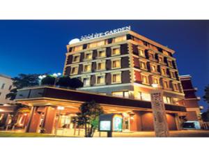 a building with a sign on top of it at Hotel Sunlife Garden - Vacation STAY 55403v in Hiratsuka +13 photos