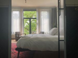 Postel nebo postele na pokoji v ubytování Boutique Hotel Marie Marie