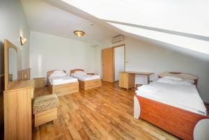 Postel nebo postele na pokoji v ubytování Nefelejcs Hotel