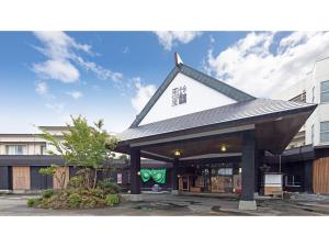a building with a roof on top of it at Tsukioka Onsen Furinya - Vacation STAY 55991v in Shibata