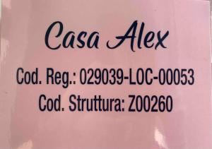 Een bord met caa aix op een roze muur. bij “Casa Alex” a pochi km dal mare in Scardovari