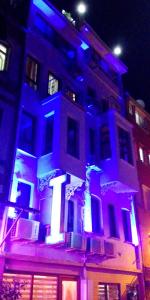a building with blue and white lights on it at Istanbul Sydney Hotel in Istanbul