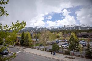 a view of a parking lot with snow covered mountains at Inn at the Carlin in Breckenridge