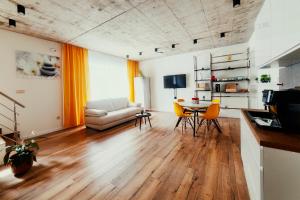 a living room with a couch and a table at BIRD HOUSE in Prešov