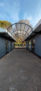 an empty building with a walkway in the middle at S & S Village Guest House in Meyerton