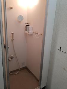 a bathroom with a shower with a hose at Guest House Tatara - Vacation STAY 61943v in Yasugi