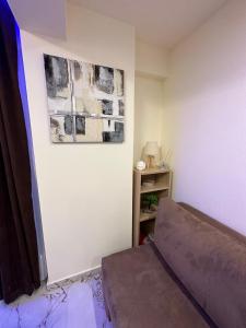 a bedroom with a bed and a picture on the wall at Blue Star #4 in Paralia Katerinis +27 photos