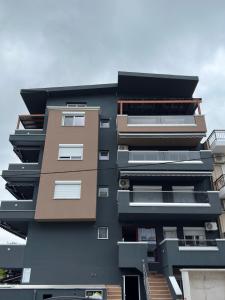 a tall building with balconies on the side of it at Blue Star #4 in Paralia Katerinis