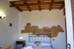 Postel nebo postele na pokoji v ubytování HOTEL Cala Buguto