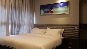 Postel nebo postele na pokoji v ubytování M Design Hotel @ Shamelin Perkasa