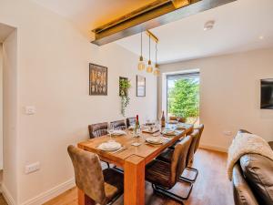 a dining room with a wooden table and chairs at The Warren - Uk42858 in Rise