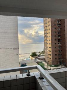 a view of the beach from the balcony of a building at American Flat in São Luís
