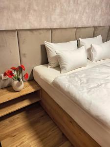 Säng eller sängar i ett rum på Vila Urbana Luxury Apartments