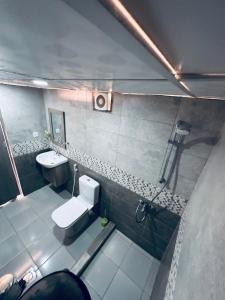 an overhead view of a bathroom with a toilet and sink at Wadi rum eagle Luxury camp in Wadi Rum