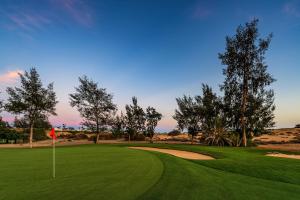 a view of a golf course with a green at Bungalow Capri Maspalomas in San Bartolomé