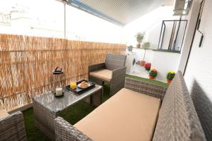 a small balcony with a table and chairs on a patio at Penthouse in the Heart of Athens in Athens