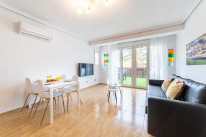 a living room with a couch and a table at Trendy Homes Chumberas in Roquetas de Mar