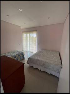 Cama o camas de una habitación en Chacara Mimosa