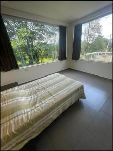 Cama o camas de una habitación en Chacara Mimosa
