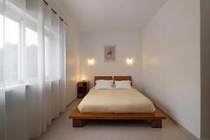 Ένα ή περισσότερα κρεβάτια σε δωμάτιο στο Vila Carvoeiro +26 φωτογραφίες