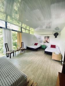 Postel nebo postele na pokoji v ubytování Cabaña Tierra Verde eje Cafetero