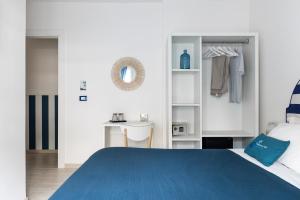 Łóżko lub łóżka w pokoju w obiekcie B&B Sapore di Mare nel Blu