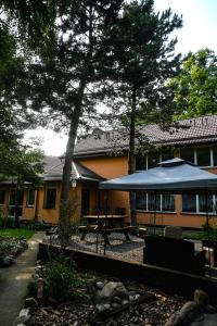 a house with a picnic table in front of it at Pokoje gościnne „SEN” in Iława