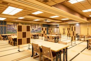 a dining room with tables and chairs in it at Ryokan Ginkaku Kyoto in Kyoto