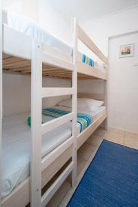 a bunk bed room with two bunk beds at Apartment Preko 8179b in Preko
