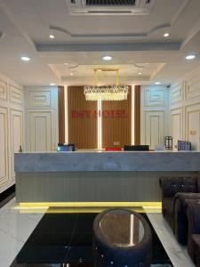 a lobby with a bar with a sign that reads diverted at Alia Express Dey Hotel Kota Bharu in Kota Bharu