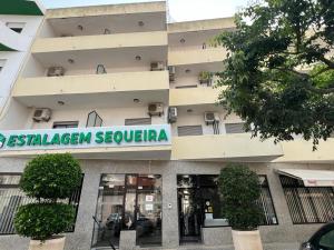 a building with a sign that reads desalinayan requena at Estalagem Sequeira in São Brás de Alportel