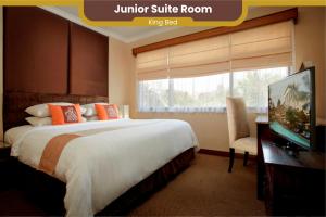 Voodi või voodid majutusasutuse The Jayakarta Yogyakarta Hotel & Spa toas