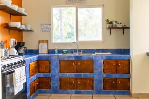 A kitchen or kitchenette at Rancho AlMar - Villa Palmeras