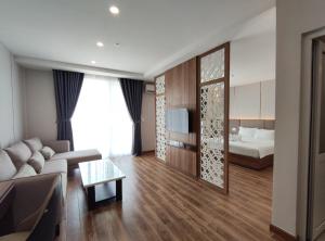 Postel nebo postele na pokoji v ubytování HO TRAM GOLDEN HOTEL