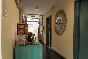 a hallway of a restaurant with a counter and a mirror at Trip Monkey Zona G in Bogotá