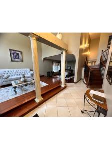 a living room with a couch and a table at Hotel/Home in Windsor