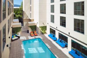 an overhead view of a pool in the courtyard of a building at Aloft Cupertino in Cupertino