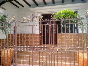 a metal gate with plants on it in a room at Villa del Prado in Medellín