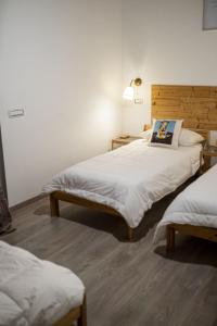 En eller flere senger på et rom på Il Giardino Di Epicuro