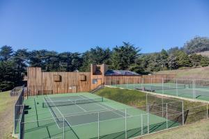 an outdoor tennis court with two tennis courts at Coastal Calm at Sea Ranch in Sea Ranch