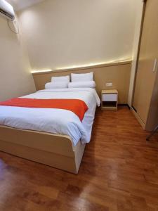 Ein Bett oder Betten in einem Zimmer der Unterkunft core inn juwita hotel