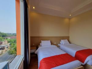Postel nebo postele na pokoji v ubytování core inn juwita hotel