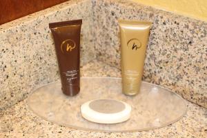 two tubes ofodorizers sitting on a counter at Rosen Inn Lake Buena Vista in Orlando