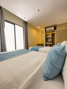 Giường trong phòng chung tại LyGia Villa Long Hải